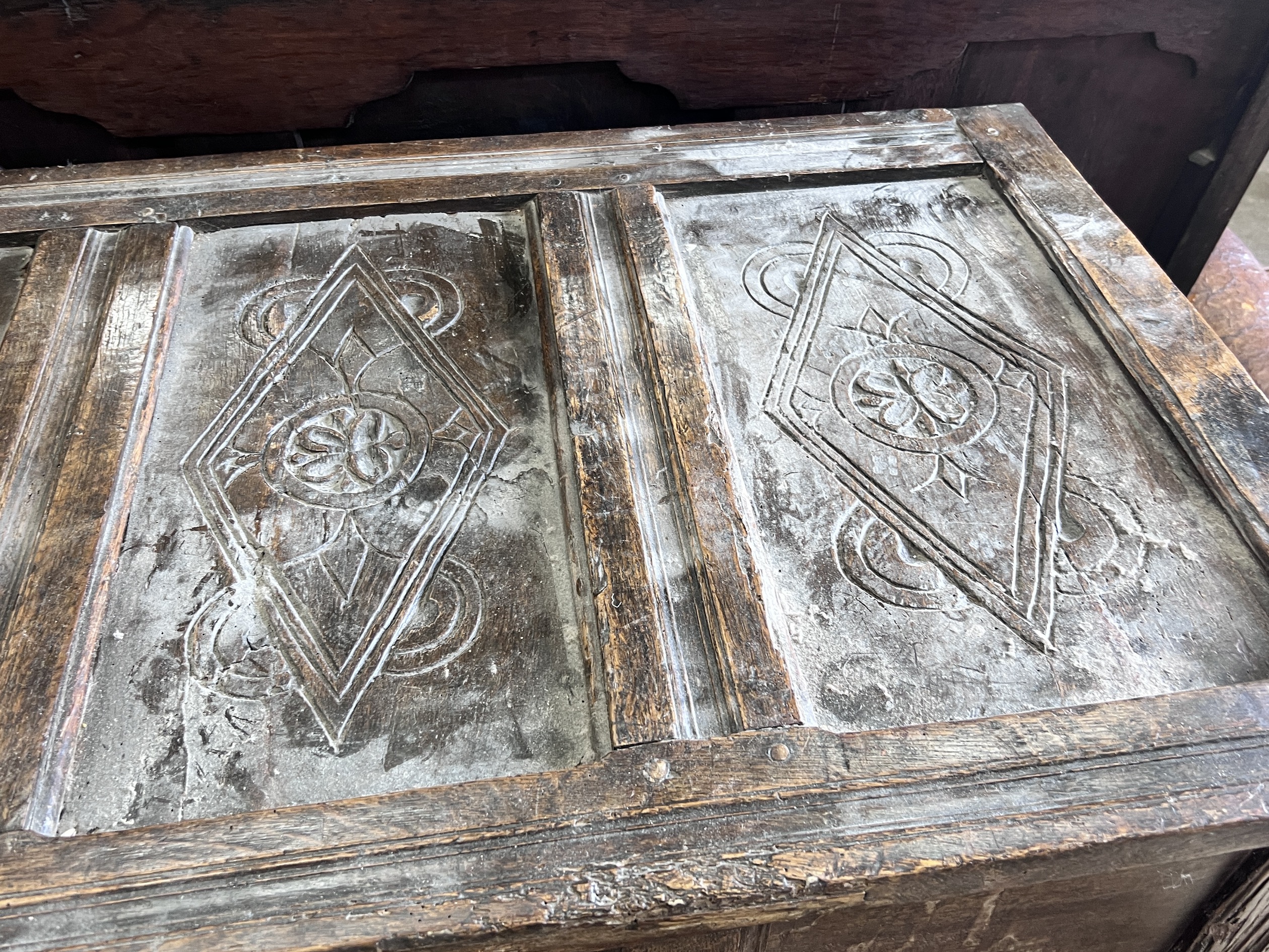 An 18th century panelled oak coffer, length 140cm, depth 61cm, height 92cm